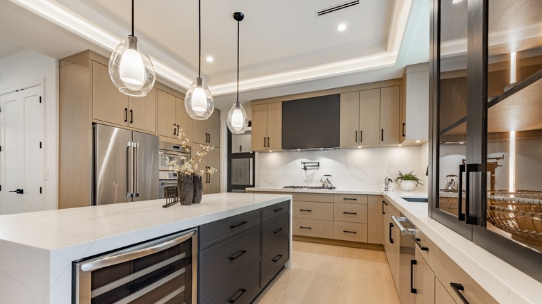Pendant lights hanging from ceiling in kitchen