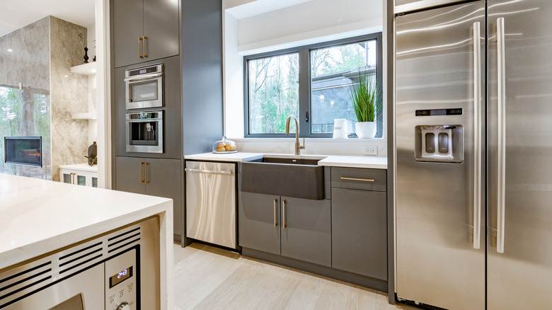 large kitchen with stainless steel appliances and hardwood floors