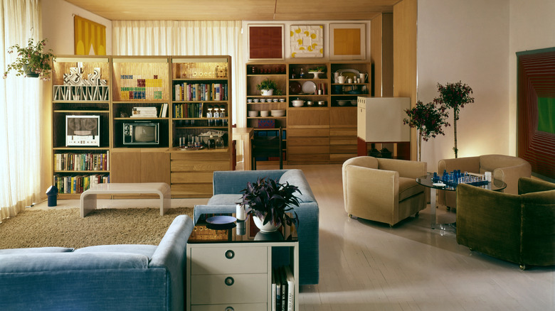 1960s living room with muted color palette and blondewood built-in shelves