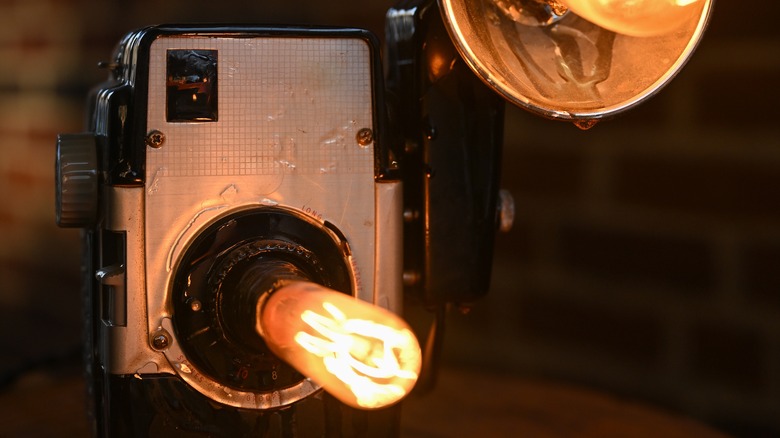 old camera with edison bulb