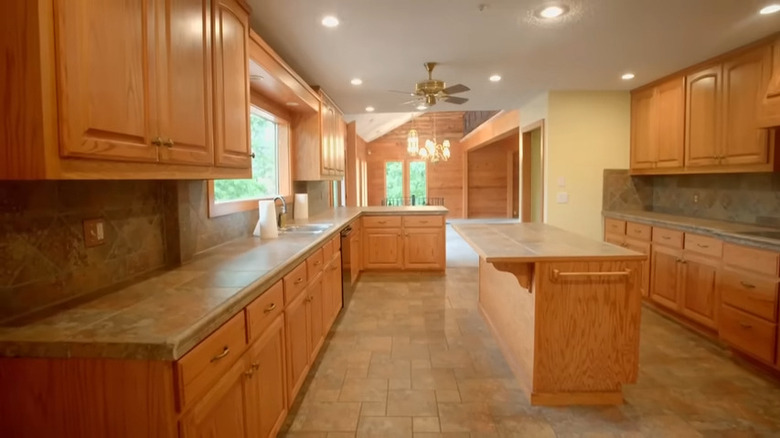stone tiles and wood cabinets