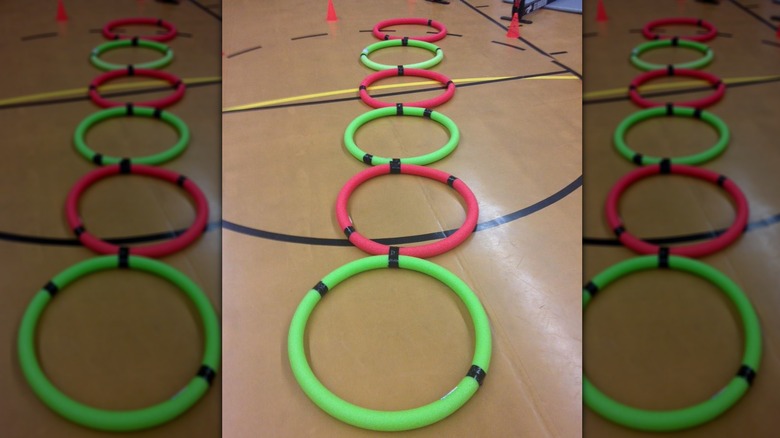 taped pool noodles on the floor