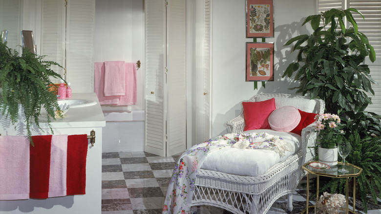 A bathroom in the 1980s decorated with Floridian style including a lanai chair