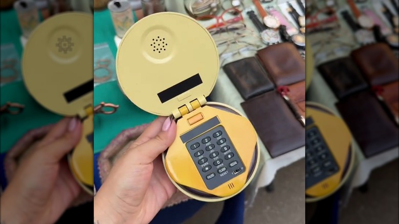 Woman holding retro hamburger phone