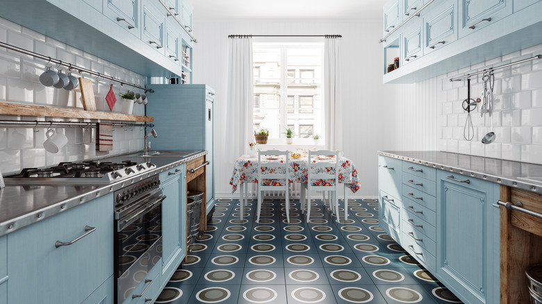 A baby blue retro kitchen with geometric tiling