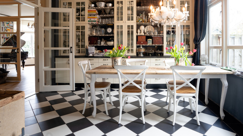 Black and white checkerboard floors in a modern farmhouse-inspired kitchen