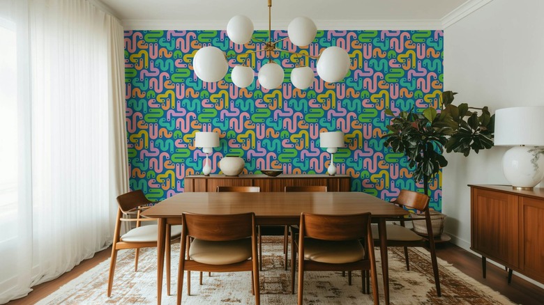 Dinning room with colorful squiggle Memphis design style wallpaper.