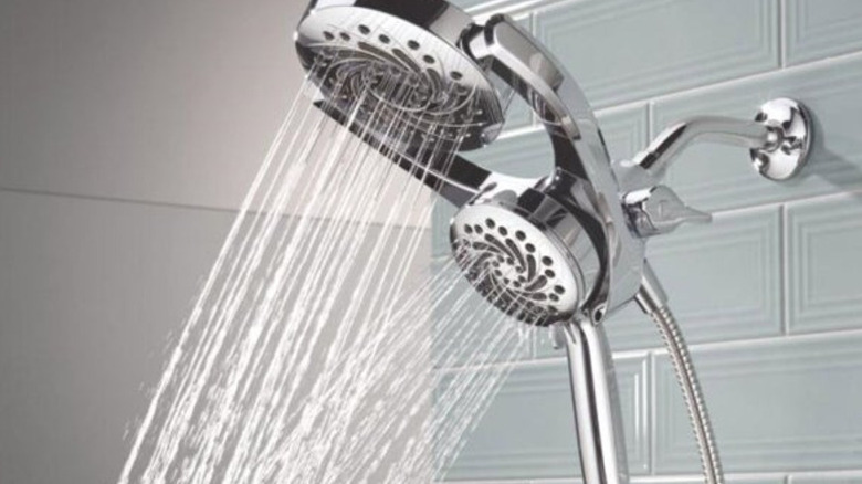The Delta 5-Setting HydroRain dual showerheads in a tiled shower