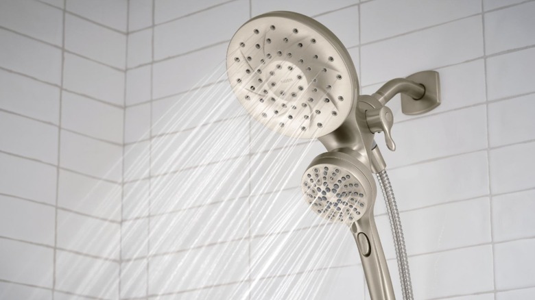 The Moen Engage dual showerhead is shown with water flowing through