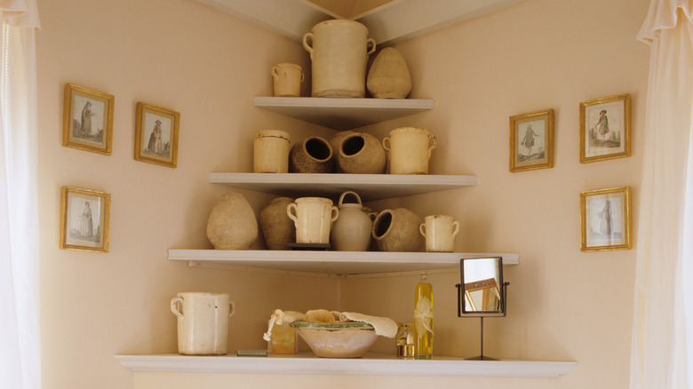 Pottery on triangular corner shelves