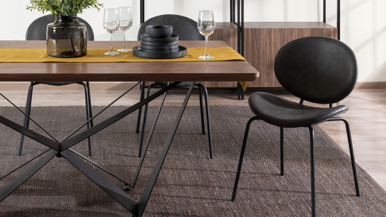 A dining room with a geometric dining table.