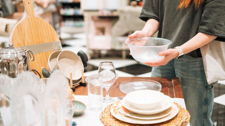 Person browsing kitchen tableware at store