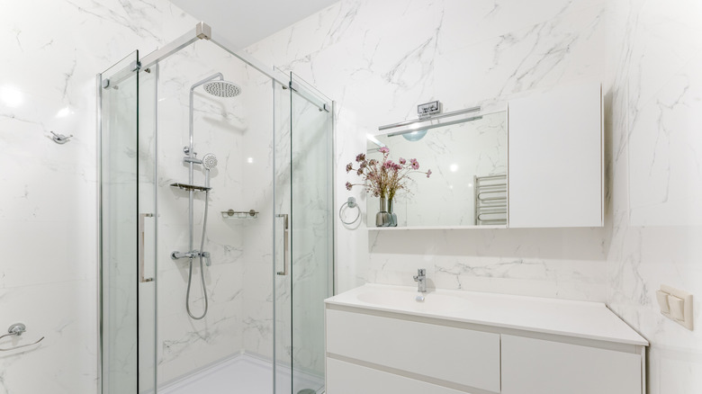 an all white marble bathroom