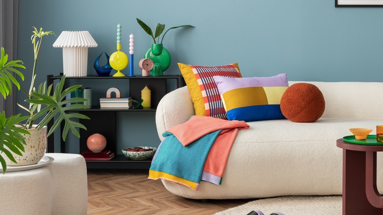 Brightly-colored living room filled with knick knacks