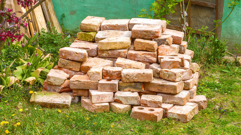 pile of leftover bricks in yard