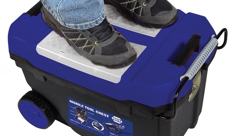 Person standing on a NAPA Mobile Tool Box