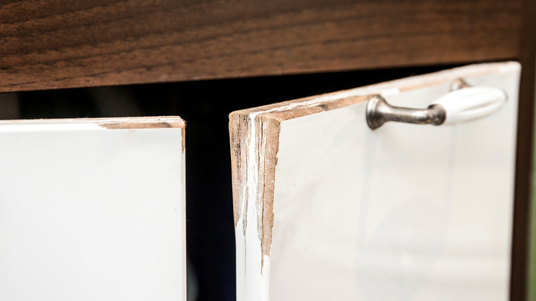 A severely warped cabinet door