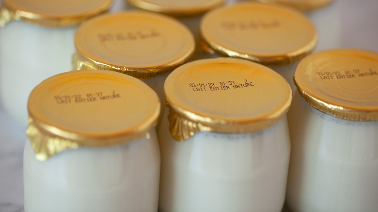 A selection of glass yogurt pots with gold foil tops