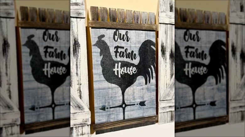 Garden sign of chicken made from wood paint sticks and flag