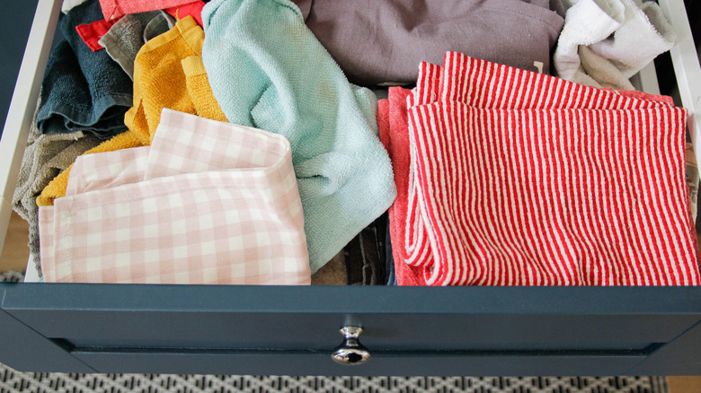 Cleaning towels in a messy jumble in a kitchen drawer