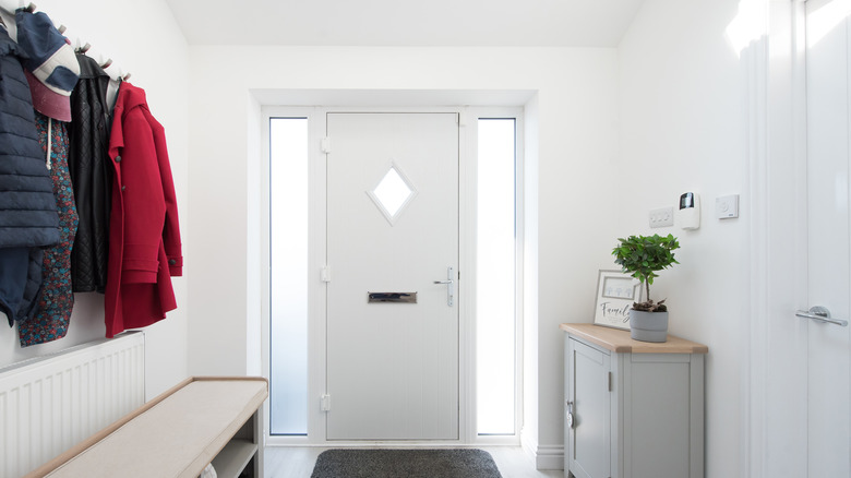 A modest entryway with a console near the door