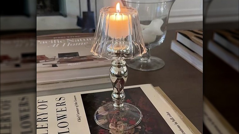 A photo of the trending tealight holder from HomeGoods in use on a coffee table