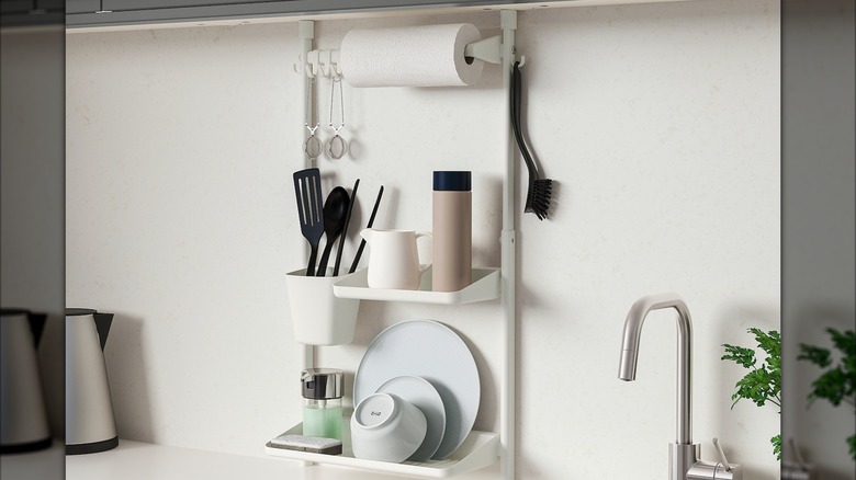 IKEA sunnersta holding kitchenware and paper towel next to sink