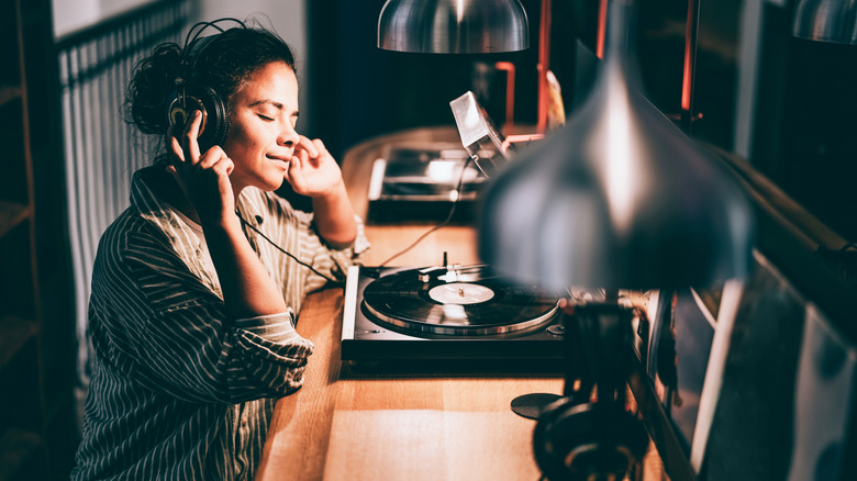 Woman listens to an LP record