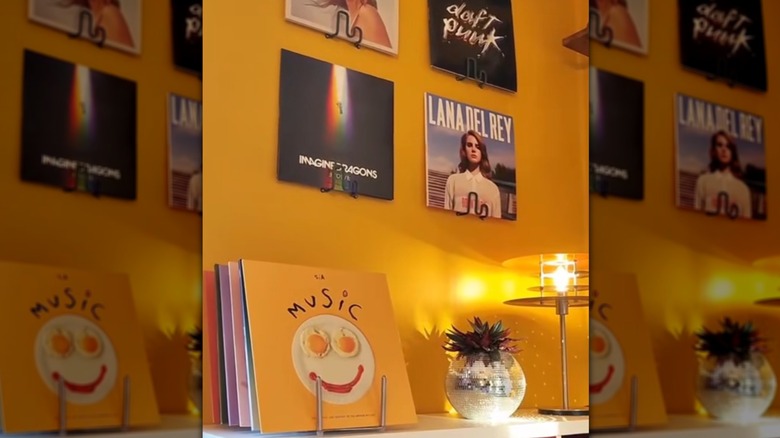 Records displayed on IKEA hooks and pot lid holder