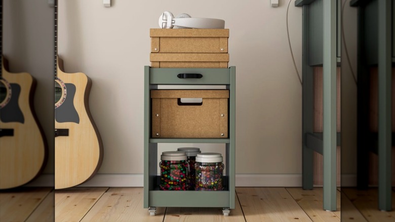 IKEA BRYTNING loaded with a variety of boxes and jars