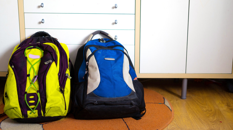 Backpack on the floor by home's entrance