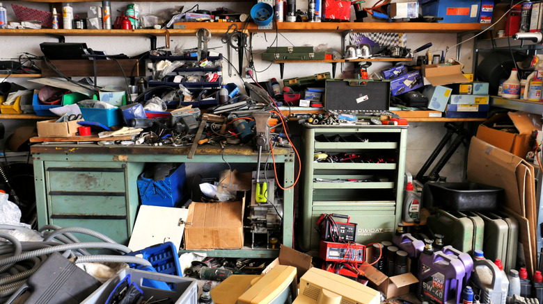 A very messy garage workspace.