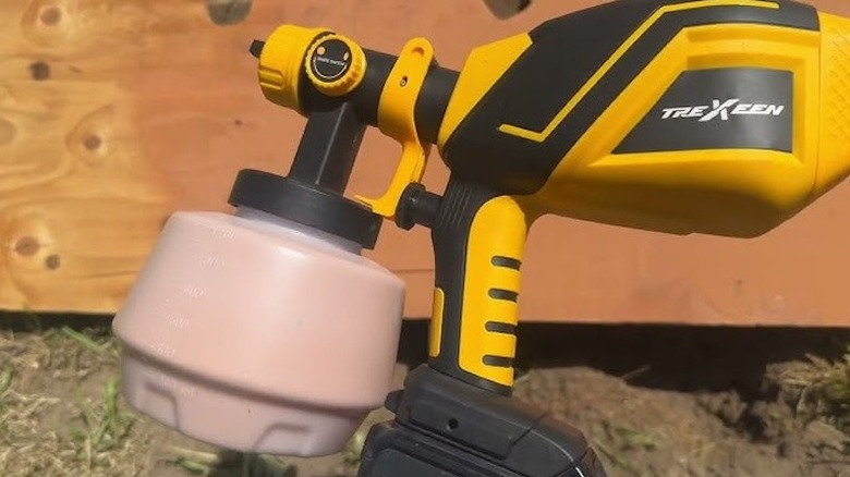 The Trexeen paint sprayer being used outdoors