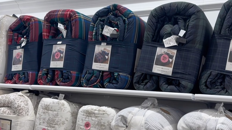 Plaid comforter sets on a store shelf
