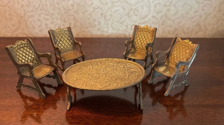 Small brass dining set on a wood table