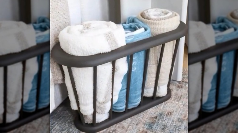 Rolled towels in a magazine rack