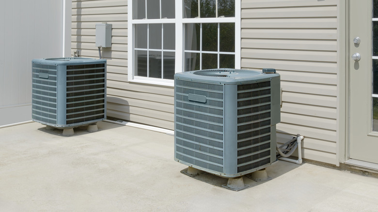 two air condenser units on home patio