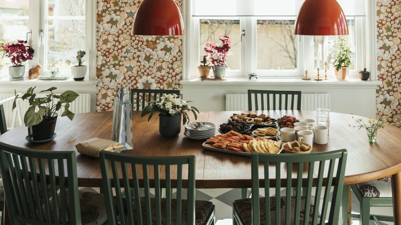 traditional wood dining table with meal and place settings