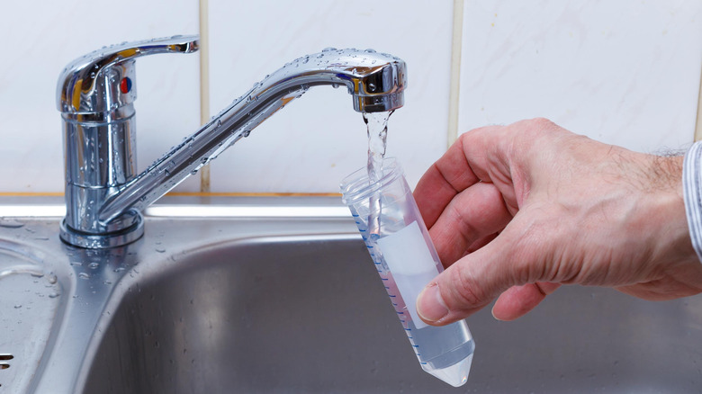 collecting water sample from tap