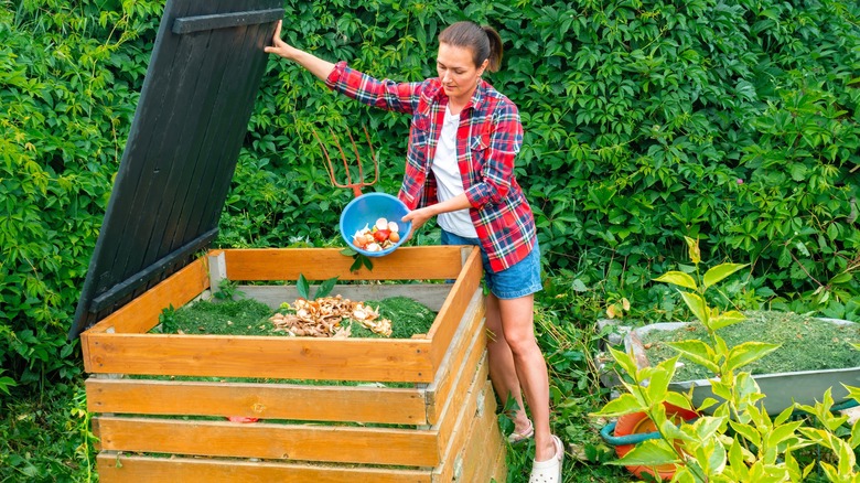 Woman making food scrap compost