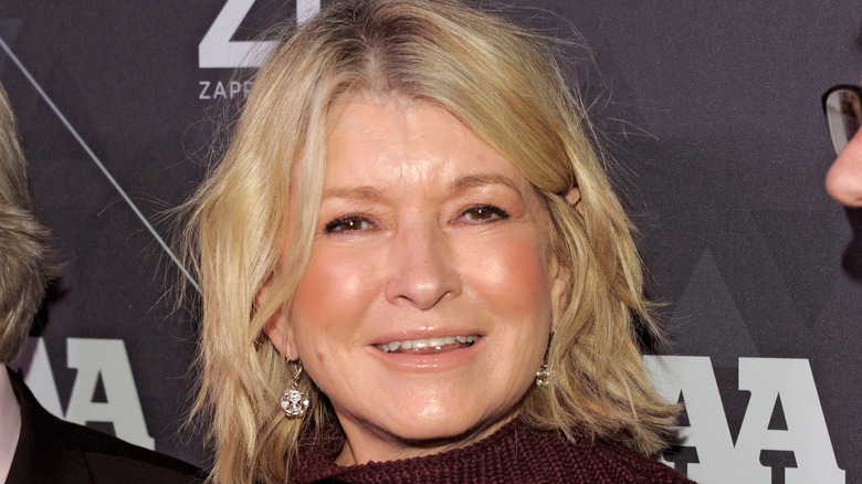 Martha Stewart smiling in maroon sweater