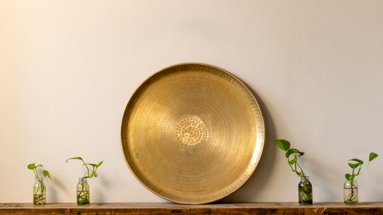 aging brass tray in a minimalist home
