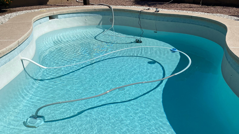 An inground pool is drained for repairs.