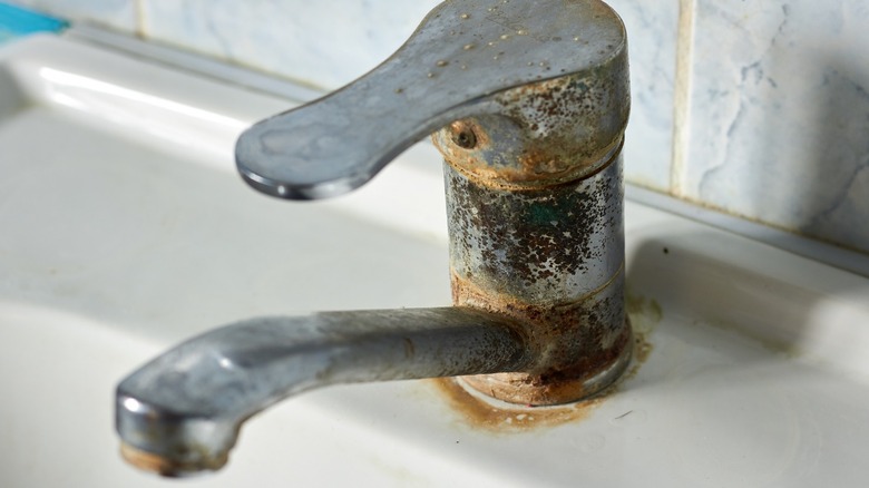 faucet with hard water stain and rust