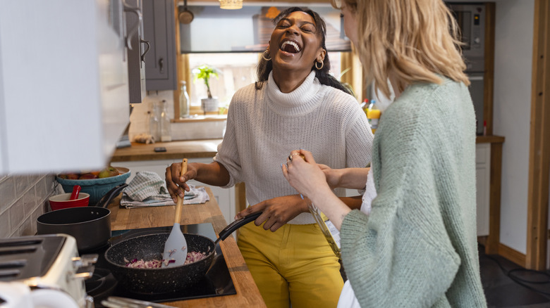 Women cooking in kitchen