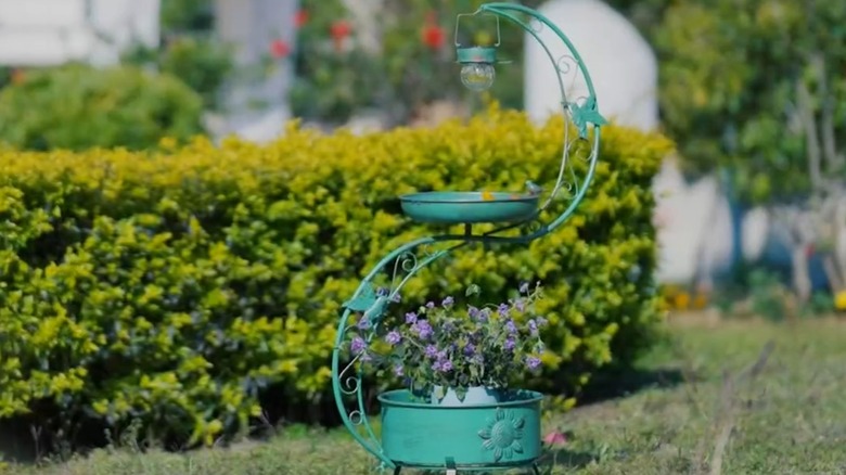 Teal bird bath with flower planter pedestal