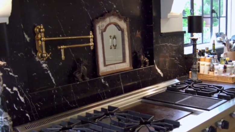 The kitchen in Nate Berkus and Jeremiah Brent's LA home features an antique mirror above the stove