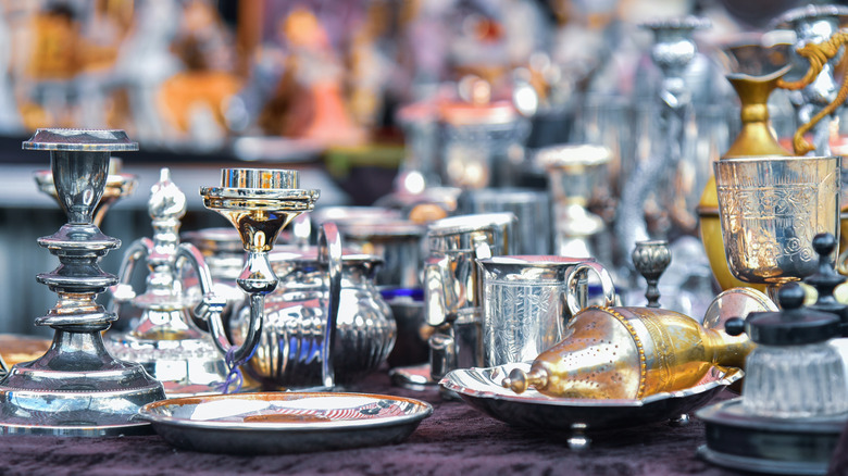 A collection of silver items at a flea market