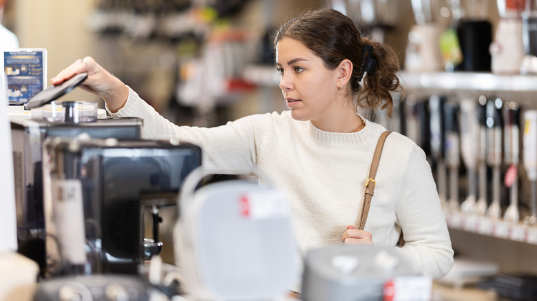 woman shopping for kitchen appliances