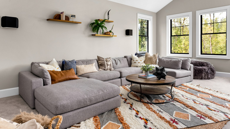 Living room with a large, colorful, plush area rug